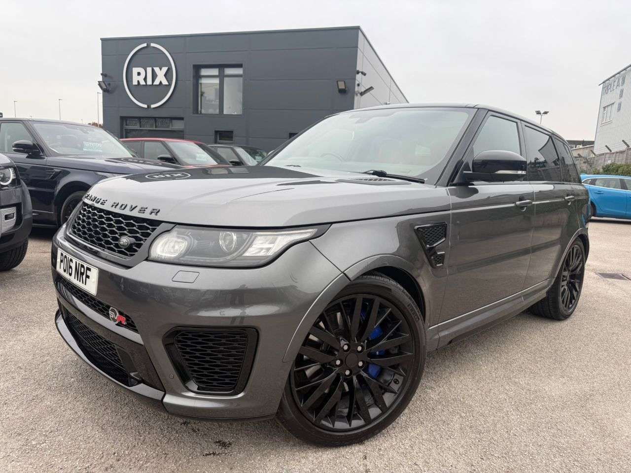A 2016 LAND ROVER RANGE ROVER SPORT SVR 5.0L FINISHED IN CORRIS GREY WITH TWO TONE RED AND BLACK LEATHER BUCKET A 2016 LAND ROVER RANGE ROVER SPORT SVR 5.0L FINISHED IN CORRIS GREY WITH TWO TONE RED AND BLACK LEATHER BUCKET