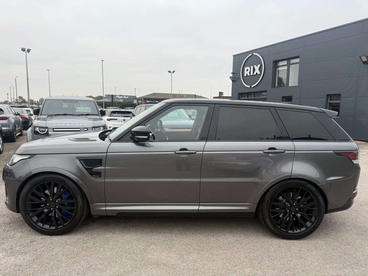 A 2016 LAND ROVER RANGE ROVER SPORT SVR 5.0L FINISHED IN CORRIS GREY WITH TWO TONE RED AND BLACK LEATHER BUCKET A 2016 LAND ROVER RANGE ROVER SPORT SVR 5.0L FINISHED IN CORRIS GREY WITH TWO TONE RED AND BLACK LEATHER BUCKET