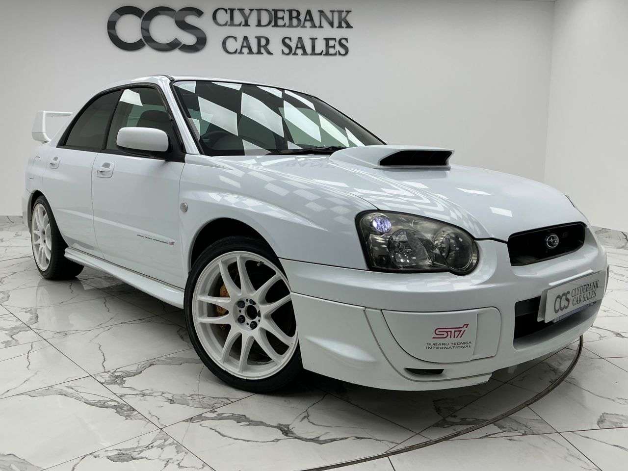 A 2003 SUBARU IMPREZA 2.5 WRX STI Type UK Saloon 4dr Petrol Manual (257 g/km, 278 bhp) Reverse Ca A 2003 SUBARU IMPREZA 2.5 WRX STI Type UK Saloon 4dr Petrol Manual (257 g/km, 278 bhp) Reverse Ca