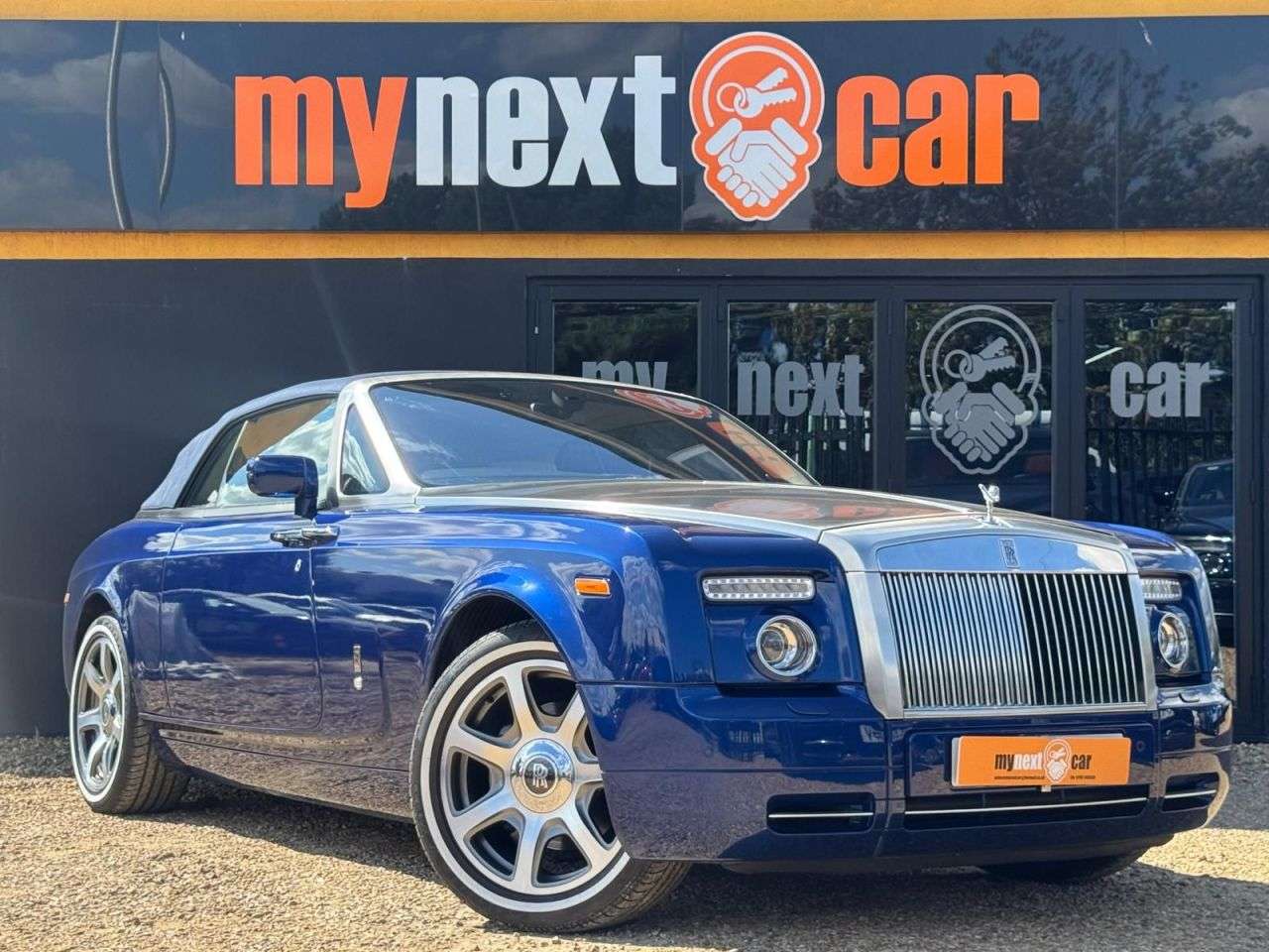 A 2007 ROLLS-ROYCE PHANTOM 6.7 V12 Drophead Coupe 2dr Petrol Auto Euro 4 (453 bhp) METROPOLITAN BLUE + A 2007 ROLLS-ROYCE PHANTOM 6.7 V12 Drophead Coupe 2dr Petrol Auto Euro 4 (453 bhp) METROPOLITAN BLUE +