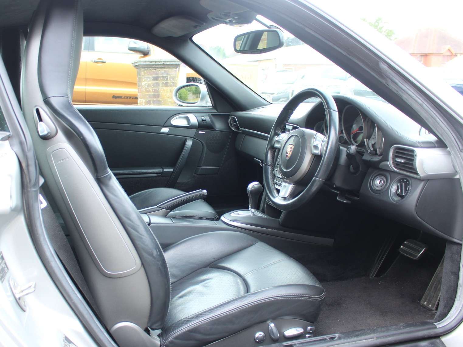 A 2005 PORSCHE 911 3.8 997 Carrera S Coupe 2dr Petrol Automatic (277 g/km, 350 bhp) A 2005 PORSCHE 911 3.8 997 Carrera S Coupe 2dr Petrol Automatic (277 g/km, 350 bhp)