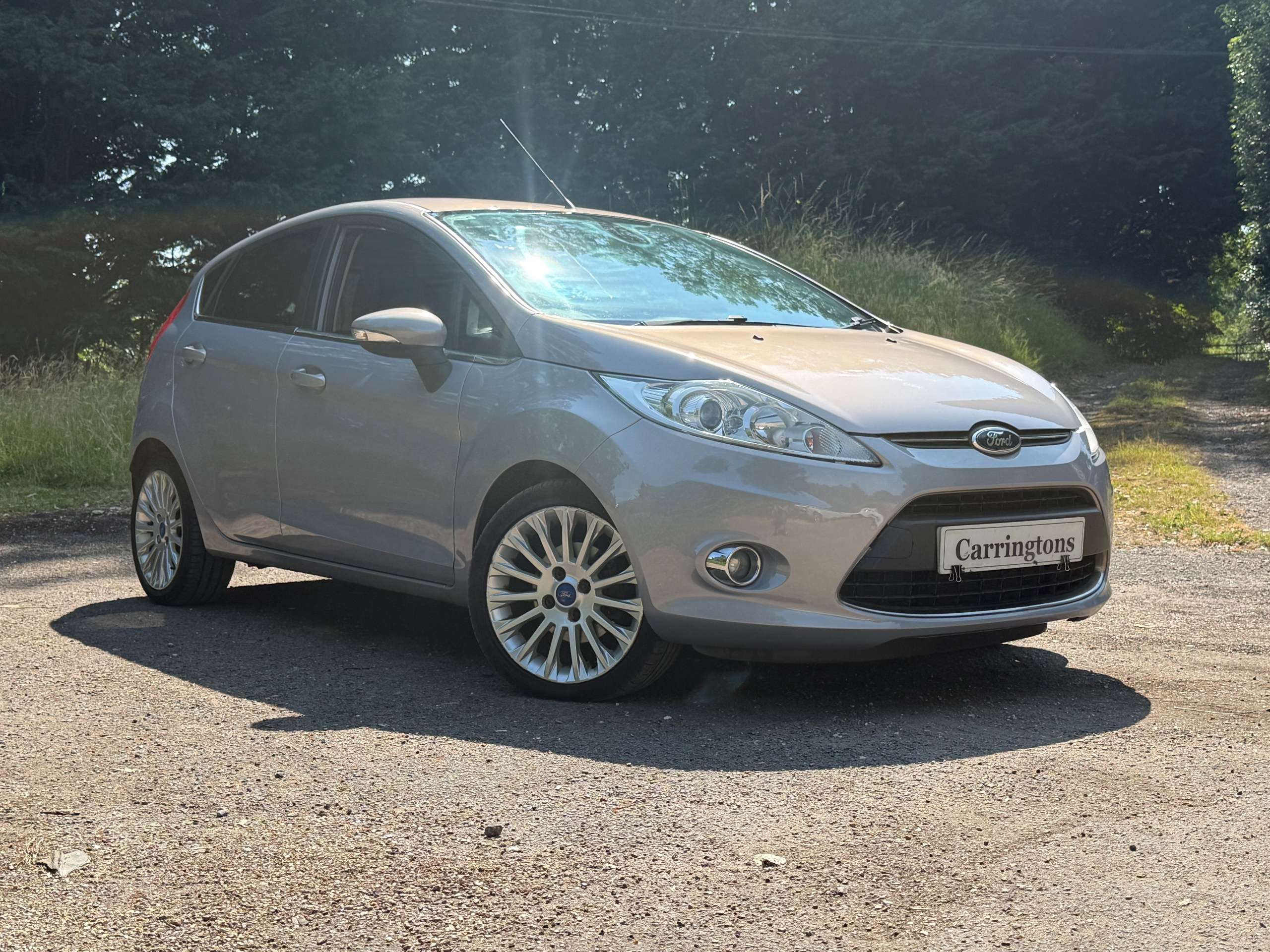 A 2012 FORD FIESTA 1.4 Titanium Hatchback 5dr Petrol Manual (130 g/km, 94 bhp) A 2012 FORD FIESTA 1.4 Titanium Hatchback 5dr Petrol Manual (130 g/km, 94 bhp)