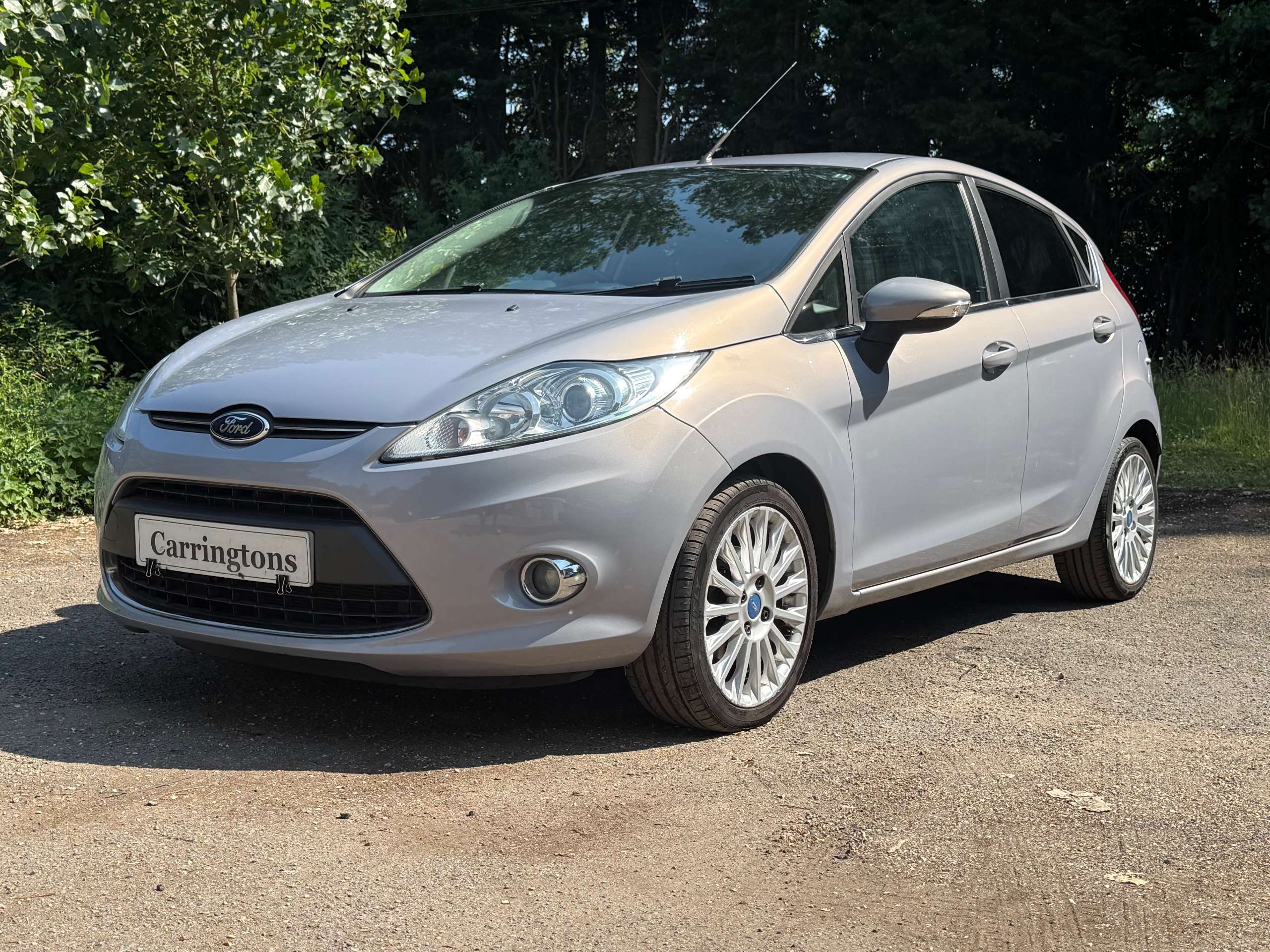 A 2012 FORD FIESTA 1.4 Titanium Hatchback 5dr Petrol Manual (130 g/km, 94 bhp) A 2012 FORD FIESTA 1.4 Titanium Hatchback 5dr Petrol Manual (130 g/km, 94 bhp)