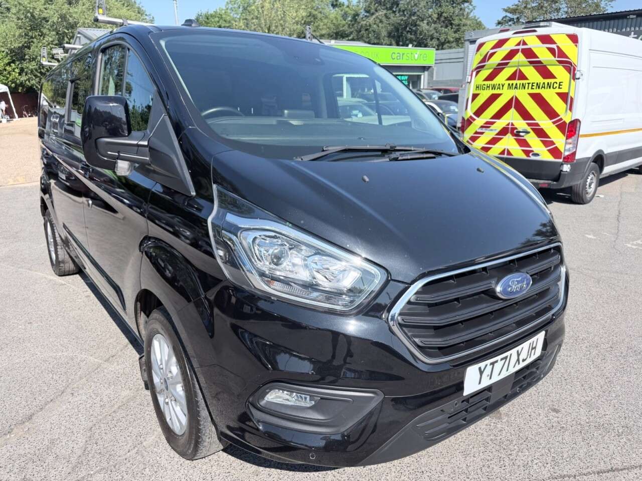 A 2021 FORD TRANSIT CUSTOM Black 2.0 300 EcoBlue Limited L2 van, 26,700 miles, Rear seats & windows Co A 2021 FORD TRANSIT CUSTOM Black 2.0 300 EcoBlue Limited L2 van, 26,700 miles, Rear seats & windows Co