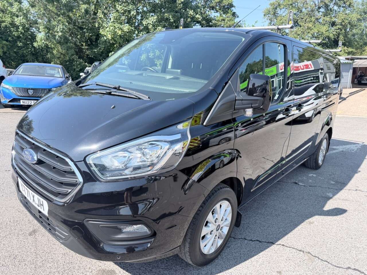 A 2021 FORD TRANSIT CUSTOM Black 2.0 300 EcoBlue Limited L2 van, 26,700 miles, Rear seats & windows Co A 2021 FORD TRANSIT CUSTOM Black 2.0 300 EcoBlue Limited L2 van, 26,700 miles, Rear seats & windows Co