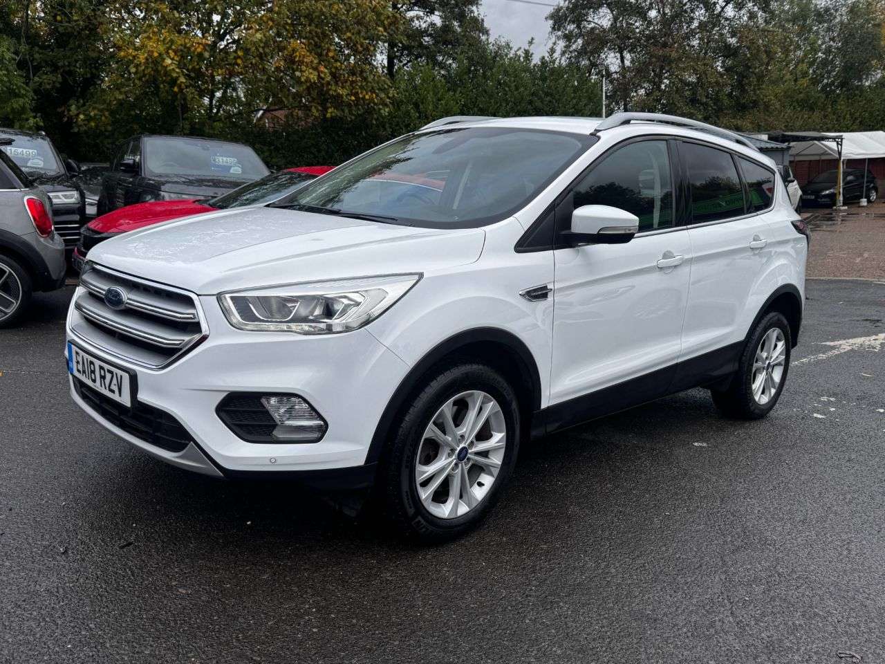 A 2018 FORD KUGA 2.0 TDCi Titanium SUV 5dr Diesel Manual Euro 6 (s/s) (150 ps) in white with A 2018 FORD KUGA 2.0 TDCi Titanium SUV 5dr Diesel Manual Euro 6 (s/s) (150 ps) in white with