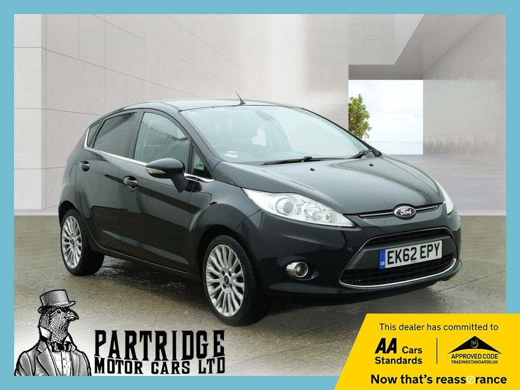 A 2012 FORD FIESTA 1.4 Titanium Hatchback 5dr Petrol Manual (130 g/km, 94 bhp) AIR CON, ALLOYS A 2012 FORD FIESTA 1.4 Titanium Hatchback 5dr Petrol Manual (130 g/km, 94 bhp) AIR CON, ALLOYS
