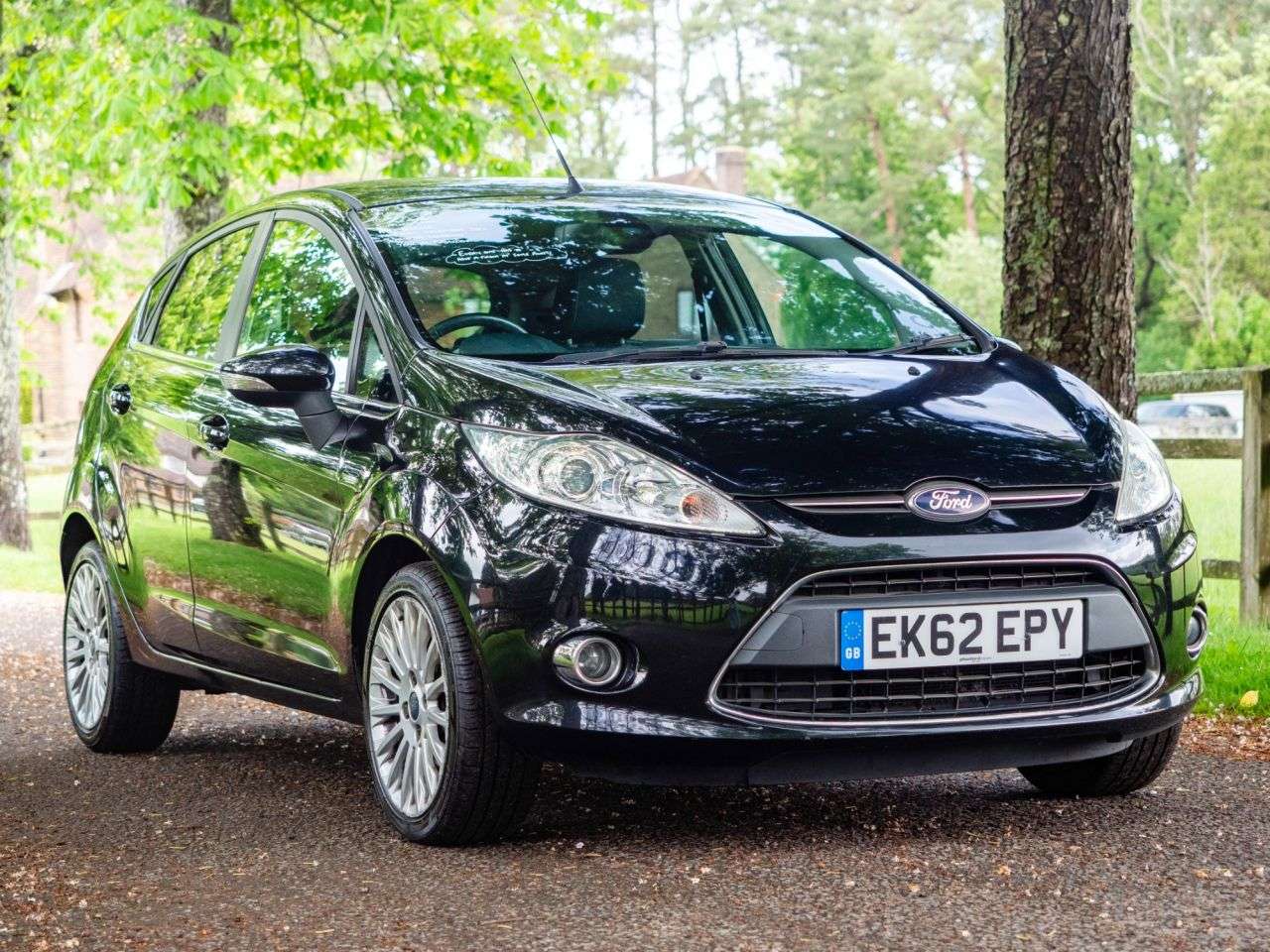 A 2012 FORD FIESTA 1.4 Titanium Hatchback 5dr Petrol Manual (130 g/km, 94 bhp) AIR CON, ALLOYS A 2012 FORD FIESTA 1.4 Titanium Hatchback 5dr Petrol Manual (130 g/km, 94 bhp) AIR CON, ALLOYS