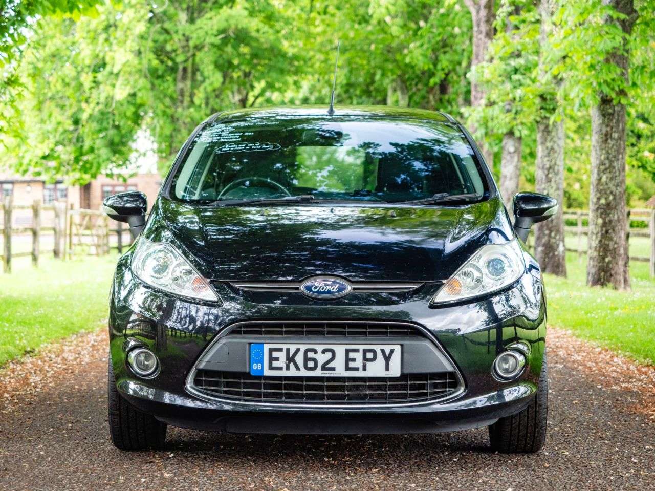 A 2012 FORD FIESTA 1.4 Titanium Hatchback 5dr Petrol Manual (130 g/km, 94 bhp) AIR CON, ALLOYS A 2012 FORD FIESTA 1.4 Titanium Hatchback 5dr Petrol Manual (130 g/km, 94 bhp) AIR CON, ALLOYS