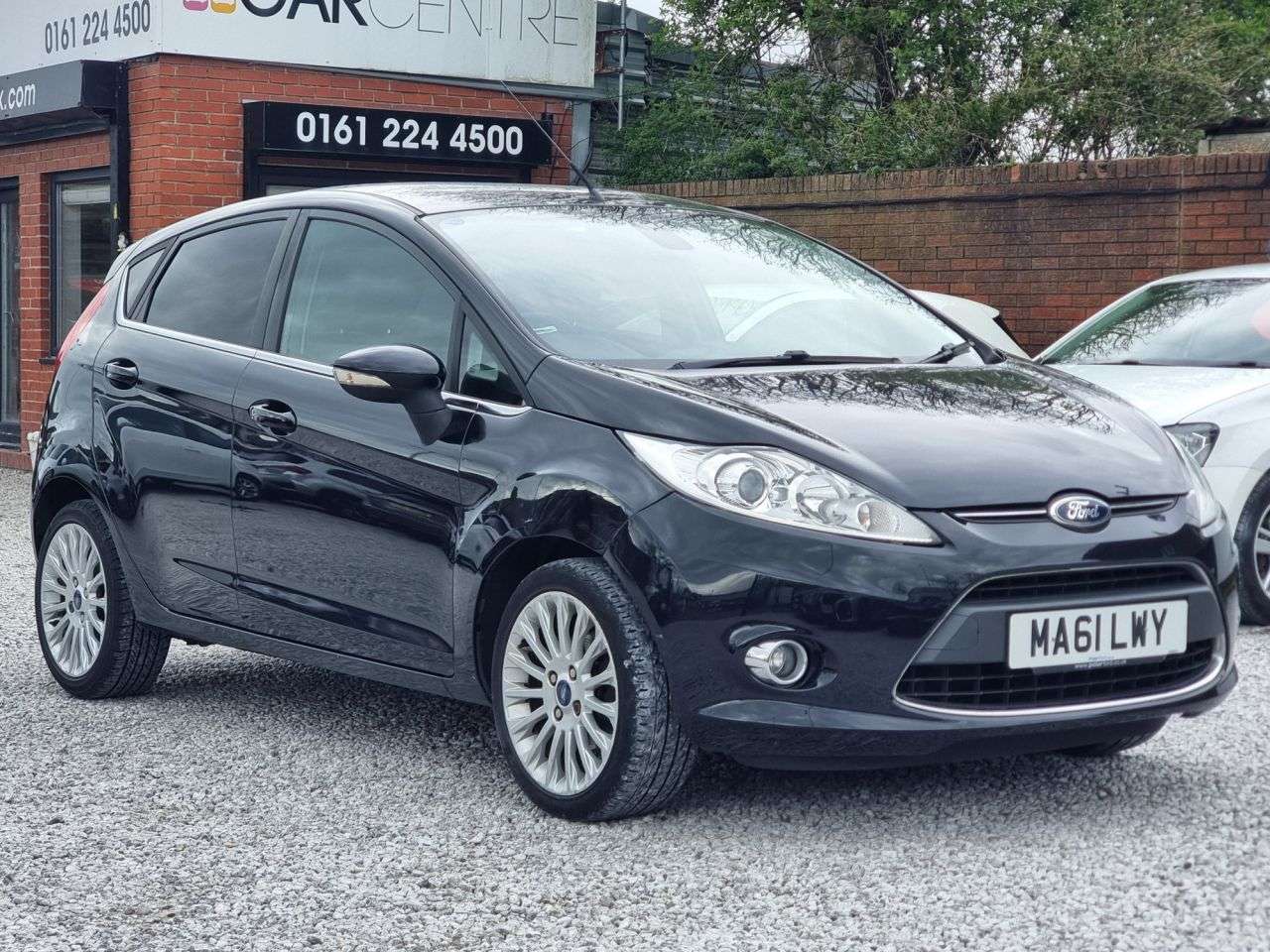 A 2011 FORD FIESTA 1.4 Titanium Hatchback 5dr Petrol Manual (133 g/km, 94 bhp) A 2011 FORD FIESTA 1.4 Titanium Hatchback 5dr Petrol Manual (133 g/km, 94 bhp)