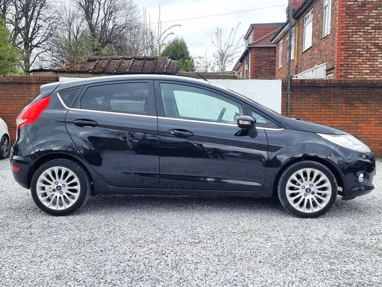 A 2011 FORD FIESTA 1.4 Titanium Hatchback 5dr Petrol Manual (133 g/km, 94 bhp) A 2011 FORD FIESTA 1.4 Titanium Hatchback 5dr Petrol Manual (133 g/km, 94 bhp)